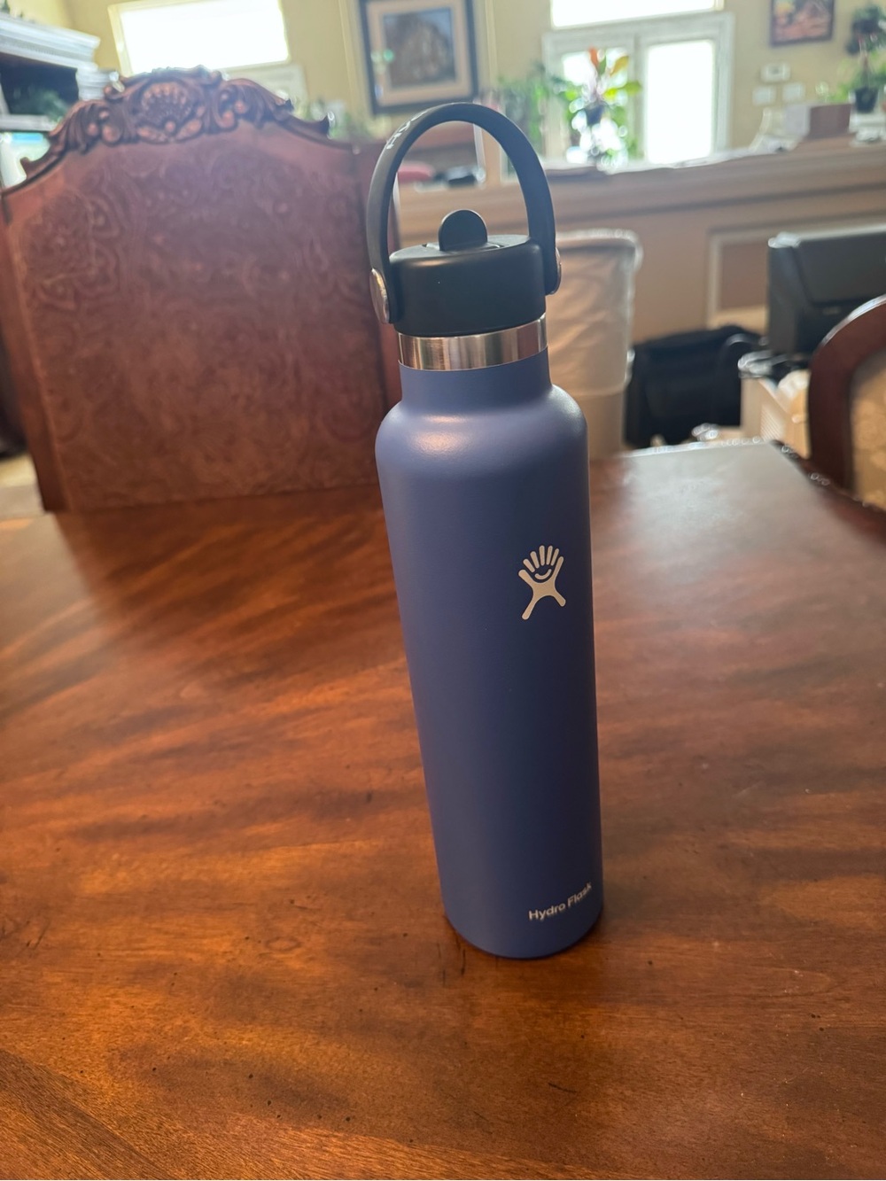 Hydroflask water bottle in blue with straw